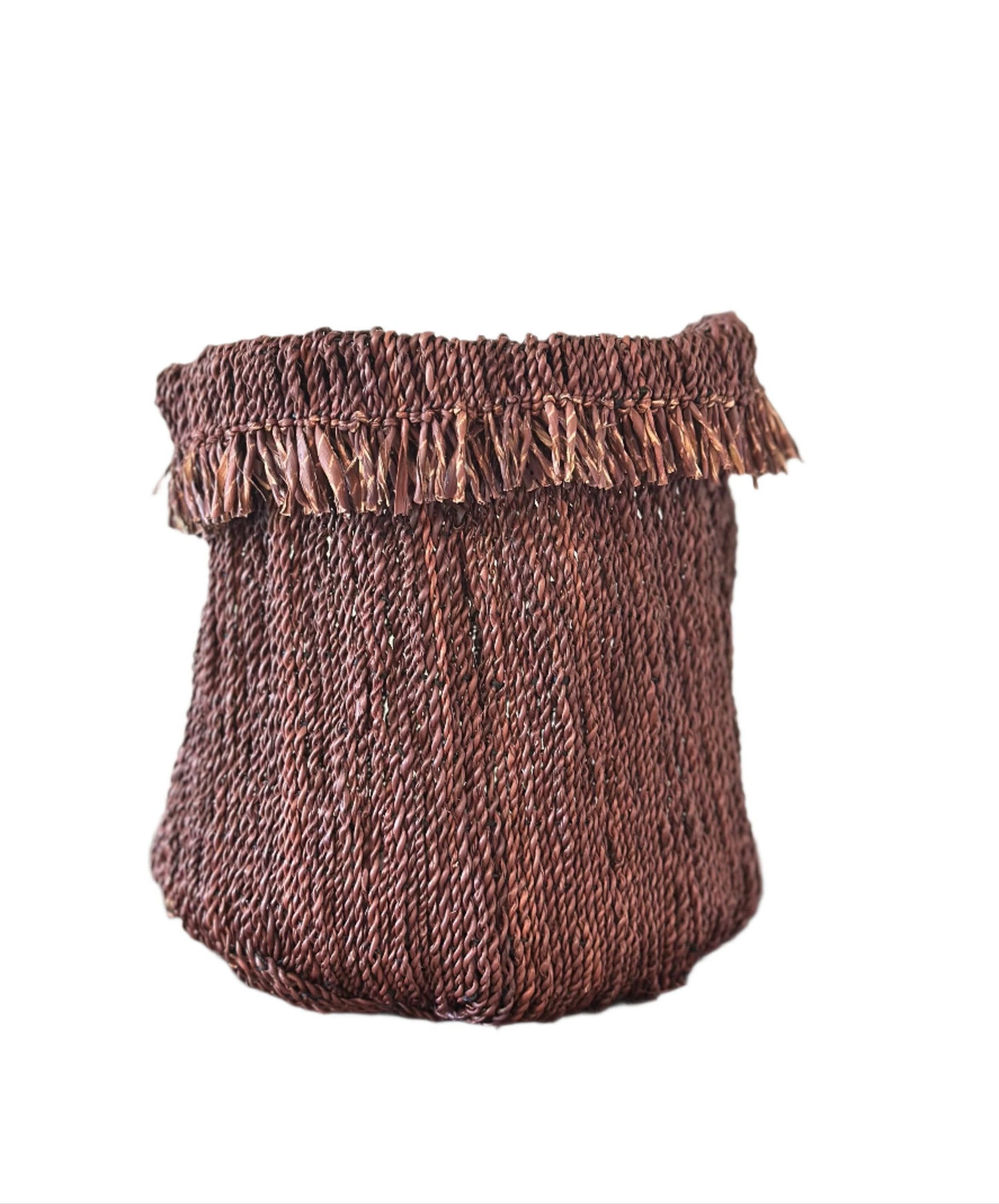 Brown woven basket with a frayed edge on a wooden surface