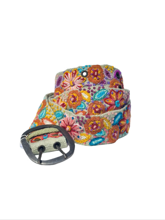 Floral patterned belt with a metal buckle on a white background